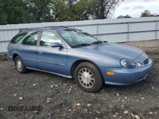 1999 Ford Taurus SE z VIN 1FAFP58S2XA261374, wystawiony jako Copart lot #74180494 z przebiegiem 193 416 mil mil oraz Szkody całkowita. Historia ofert i sprzedaży dostępna na DreamBid. Obrazek 4.