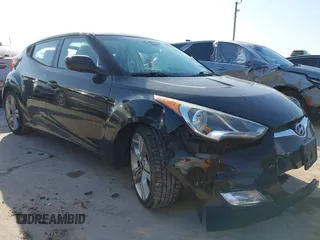 2013 Hyundai Veloster w/Black Int with VIN KMHTC6AD2DU171044, listed as a IAAI auction lot 42245907 with 140,542 mi miles and . Bid and sale history available at DreamBid. Image 1.