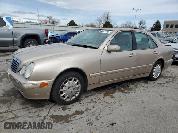 2000 Mercedes-Benz E-Class with VIN WDBJF82J0YX040071, listed as a Copart auction lot 50001165 with 145,638 mi miles and Salvage Title. Bid and sale history available at carsss.com. Image 1.