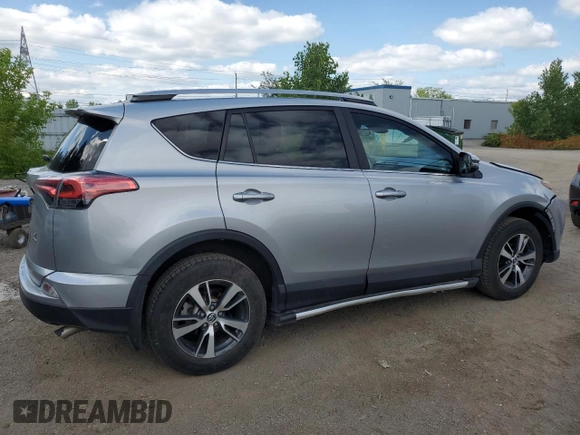 2018 Toyota RAV4 LE with VIN 2T3BFREV8JW788362, listed as a Copart auction lot 64053735 with 124,668 mi miles and Salvage title. Bid and sale history available at DreamBid. Image 3.
