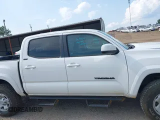 2017 Toyota Tacoma SR5 with VIN 3TMCZ5AN1HM063580, listed as a IAAI auction lot 42421660 with 95,543 mi miles and . Bid and sale history available at DreamBid. Image 14.