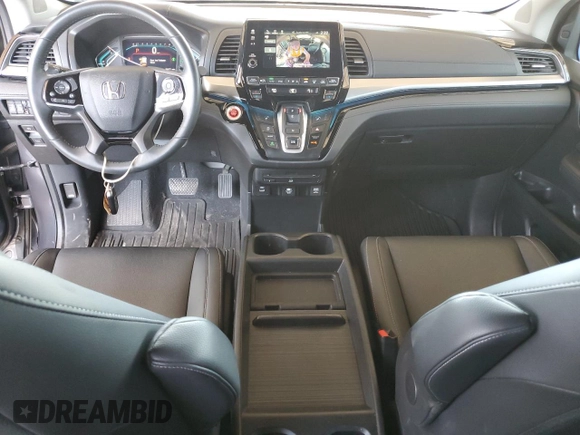 2021 Honda Odyssey Touring with VIN 5FNRL6H88MB040703, listed as a Copart auction lot 60340095 with 66,171 mi miles and Salvage title. Bid and sale history available at DreamBid. Image 8.