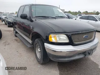 2003 Ford F-150 XLT with VIN 1FTRW07613KD14135, listed as a IAAI auction lot 41879756 with 197,515 mi miles. Bid and sale history available at carsss.com. Image 1.