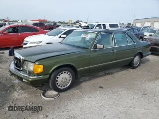 1990 Mercedes-Benz 560 with VIN WDBCA39E4LA548591, listed as a Copart auction lot 70799134 with 146,323 mi miles and Salvage Title. Bid and sale history available at DreamBid. Image 1.