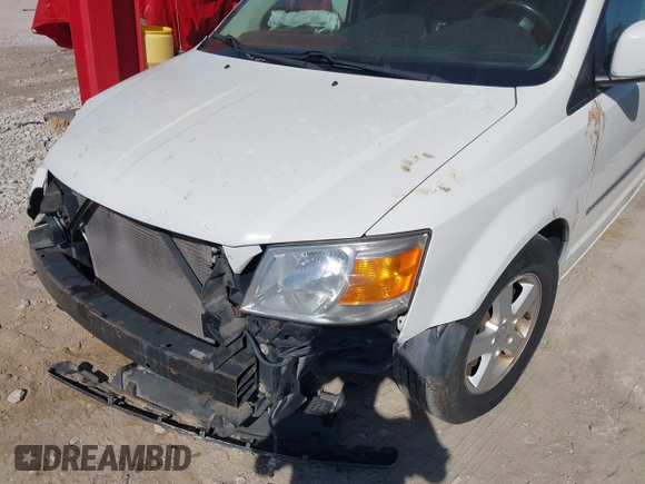2010 Dodge Grand Caravan SXT with VIN 2D4RN5D1XAR462150, listed as a IAAI auction lot 41466381 with 204,531 mi miles and . Bid and sale history available at DreamBid. Image 14.