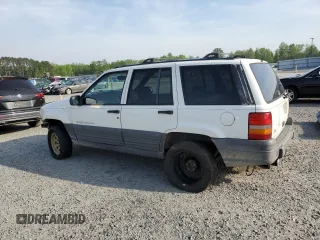 1996 Jeep Grand Cherokee Laredo z VIN 1J4EX58S3TC144191, wystawiony jako Copart lot #53153495 z przebiegiem 197 853 mil mil oraz Szkoda całkowita • Salvage title. Historia ofert i sprzedaży dostępna na DreamBid. Obrazek 2.