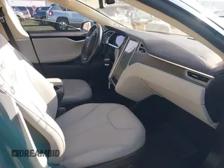 2014 Tesla Model S 60 with VIN 5YJSA1S11EFP35998, listed as a IAAI auction lot 42316563 with 83,835 mi miles and . Bid and sale history available at DreamBid. Image 5.