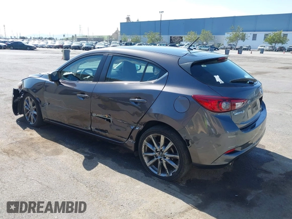 2018 Mazda 3 Touring z VIN 3MZBN1L38JM243749, wystawiony jako IAAI lot #41771812 z przebiegiem 65 533 mil mil oraz . Historia ofert i sprzedaży dostępna na DreamBid. Obrazek 3.