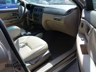 2002 Ford Taurus z VIN 1FAHP59U52G115825, wystawiony jako IAAI lot #41904552 z przebiegiem 91 004 mil mil oraz . Historia ofert i sprzedaży dostępna na DreamBid. Obrazek 5.