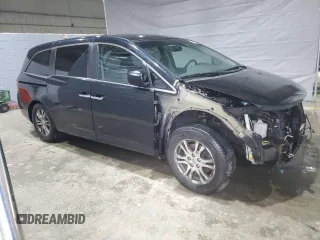 2012 Honda Odyssey EX-L with VIN 5FNRL5H6XCB100522, listed as a Copart auction lot 51431335 with 113,889 mi miles and Salvage Title. Bid and sale history available at DreamBid. Image 4.