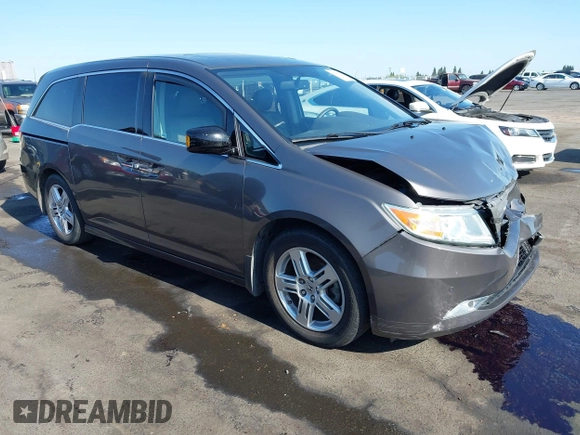 2012 Honda Odyssey Touring with VIN 5FNRL5H95CB057346, listed as a IAAI auction lot 42644094 with 114,712 mi miles and . Bid and sale history available at DreamBid. Image 1.