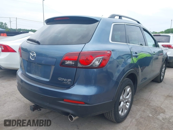 2015 Mazda CX-9 Touring with VIN JM3TB3CV9F0463819, listed as a IAAI auction lot 42506237 with 207,418 mi miles and . Bid and sale history available at DreamBid. Image 4.