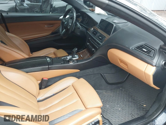 2017 BMW 6 Series 650i xDrive z VIN WBA6F7C52HD930816, wystawiony jako IAAI lot #42168478 z przebiegiem 89 191 mil mil oraz . Historia ofert i sprzedaży dostępna na DreamBid. Obrazek 5.