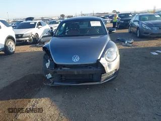 2012 Volkswagen Beetle 2.0T Turbo w/Sun/Snd/Nav PZEV with VIN 3VWVA7AT4CM628968, listed as a IAAI auction lot 41847614 with 71,813 mi miles. Bid and sale history available at carsss.com. Image 13.