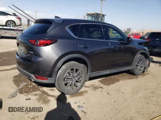 2018 Mazda CX-5 Grand Touring with VIN JM3KFADMXJ1323646, listed as a Copart auction lot 46857825 with 62,262 mi miles and Salvage title. Bid and sale history available at DreamBid. Image 3.