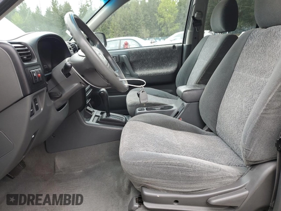 2002 Isuzu Rodeo S with VIN 4S2CK58W124301647, listed as a Copart auction lot 56973895 with 129,009 mi miles and Salvage title. Bid and sale history available at DreamBid. Image 7.