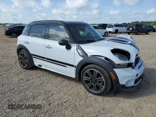 2014 MINI Countryman S with VIN WMWZC3C53EWP52333, listed as a Copart auction lot 54418495 with 34,687 mi miles and Salvage Title. Bid and sale history available at DreamBid. Image 4.