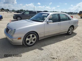 2002 Mercedes-Benz E-Class with VIN WDBJF65J02B495961, listed as a Copart auction lot 73844554 with 99,380 mi miles and Salvage Title. Bid and sale history available at carsss.com. Image 1.