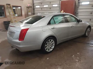 2014 Cadillac CTS Luxury AWD with VIN 1G6AX5S3XE0158960, listed as a IAAI auction lot 41258609 with 84,360 mi miles and . Bid and sale history available at DreamBid. Image 4.