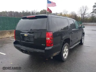 2011 Chevrolet Suburban LT with VIN 1GNSKJE33BR252584, listed as a IAAI auction lot 41985856 with 59,131 mi miles. Bid and sale history available at carsss.com. Image 4.