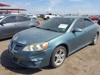 2009 Pontiac G6 1SB with VIN 1G2ZJ57K594261692, listed as a IAAI auction lot 42802373 with 200,469 mi miles and . Bid and sale history available at DreamBid. Image 6.
