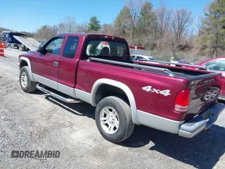 2003 Dodge Dakota SLT with VIN 1D7HG42N33S369870, listed as a IAAI auction lot 41826771 with 214,840 mi miles. Bid and sale history available at carsss.com. Image 3.