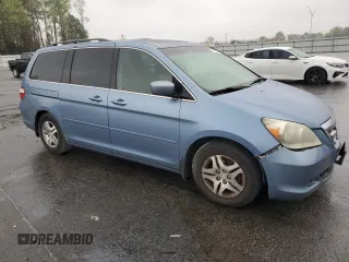 2005 Honda Odyssey EX-L with VIN 5FNRL38645B060123, listed as a Copart auction lot 51112735 with 227,247 mi miles and Salvage Title. Bid and sale history available at carsss.com. Image 4.