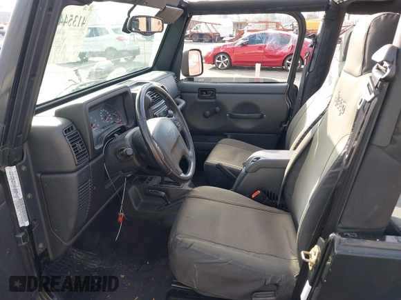 2003 Jeep Wrangler Sport with VIN 1J4FA49S23P328867, listed as a IAAI auction lot 41354414 with 96,703 mi miles. Bid and sale history available at carsss.com. Image 5.