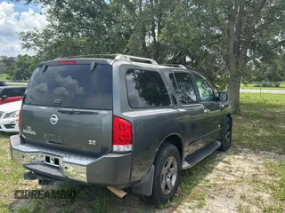 2005 Nissan Armada LE z VIN 5N1AA08A45N703735, wystawiony jako Copart lot #59034285 z przebiegiem 242 012 mil mil oraz Tytuł czysty. Historia ofert i sprzedaży dostępna na DreamBid. Obrazek 4.