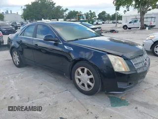 2009 Cadillac CTS RWD z VIN 1G6DF577190117392, wystawiony jako IAAI lot #42310804 z przebiegiem 136 463 mil mil oraz . Historia ofert i sprzedaży dostępna na DreamBid. Obrazek 1.