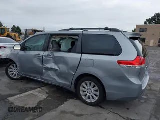 2012 Toyota Sienna XLE with VIN 5TDDK3DC9CS042847, listed as a IAAI auction lot 40970090 with 101,813 mi miles. Bid and sale history available at carsss.com. Image 3.