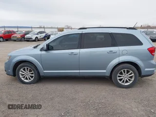 2013 Dodge Journey SXT with VIN 3C4PDDBG2DT724768, listed as a IAAI auction lot 40926457 with 150,862 mi miles and . Bid and sale history available at DreamBid. Image 14.