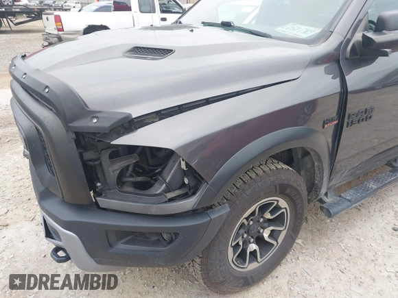 2017 Ram 1500 Rebel with VIN 1C6RR7YT5HS610293, listed as a IAAI auction lot 42454064 with 103,515 mi miles and . Bid and sale history available at DreamBid. Image 6.