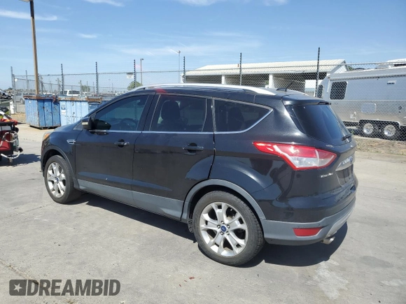 2015 Ford Escape Titanium with VIN 1FMCU0J97FUC80446, listed as a Copart auction lot 58749895 with 106,890 mi miles and Salvage title. Bid and sale history available at DreamBid. Image 2.