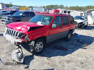 1996 Jeep Grand Cherokee Laredo with VIN 1J4EX58S8TC122302, listed as a IAAI auction lot 41218573 with 195,392 mi miles. Bid and sale history available at carsss.com. Image 2.