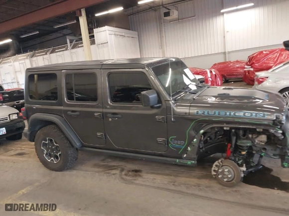 2022 Jeep Wrangler 4xe Unlimited Rubicon with VIN 1C4JJXR67NW229457, listed as a IAAI auction lot 41014010 with 53,075 mi miles. Bid and sale history available at carsss.com. Image 14.