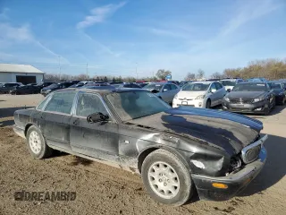 1998 Jaguar XJ with VIN SAJHX1245WC819762, listed as a Copart auction lot 81480174 with 132,491 mi miles and Salvage title. Bid and sale history available at DreamBid. Image 4.