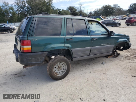 1996 Jeep Grand Cherokee Laredo with VIN 1J4GZ58S1TC340018, listed as a Copart auction lot 86571454 with 0 mi miles and Salvage Title. Bid and sale history available at carsss.com. Image 3.