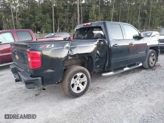 2018 Chevrolet Silverado 1500 LT with VIN 1GCVKREH9JZ115468, listed as a IAAI auction lot 40924644 with 213,059 mi miles. Bid and sale history available at carsss.com. Image 4.