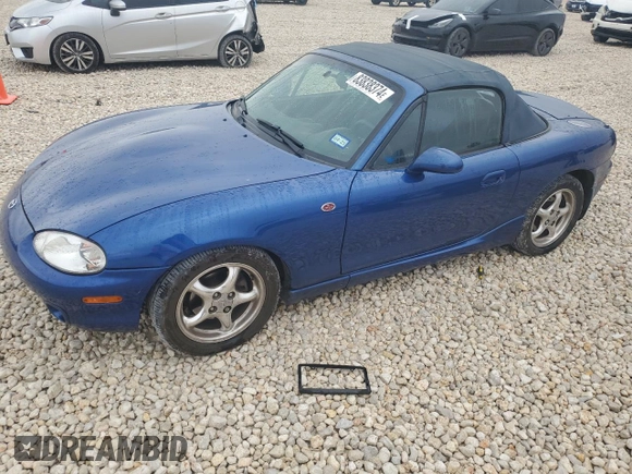 1999 Mazda MX-5 Miata with VIN JM1NB3532X0134801, listed as a Copart auction lot 83838374 with 97,015 mi miles and Salvage title. Bid and sale history available at DreamBid. Image 1.