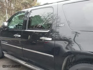 2011 Chevrolet Suburban LTZ with VIN 1GNSCKE02BR206544, listed as a IAAI auction lot 41159341 with 218,202 mi miles. Bid and sale history available at carsss.com. Image 14.
