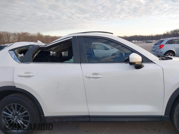 2019 Mazda CX-5 Sport with VIN JM3KFABMXK1655302, listed as a IAAI auction lot 41901293 with 140,369 mi miles and . Bid and sale history available at DreamBid. Image 13.