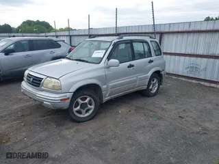 2000 Suzuki Grand Vitara JLX with VIN JS3TD62V5Y4117740, listed as a IAAI auction lot 42088696 with 166,484 mi miles. Bid and sale history available at carsss.com. Image 2.