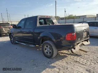 2001 Ford F-150 SuperCrew XLT with VIN 1FTRW07W41KE36887, listed as a Copart auction lot 76418694 with 280,470 mi miles and Salvage Title. Bid and sale history available at carsss.com. Image 2.