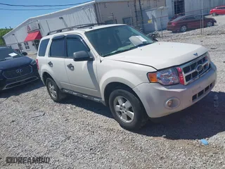 2010 Ford Escape XLT with VIN 1FMCU0D74AKC67975, listed as a IAAI auction lot 41996023 with 199,626 mi miles. Bid and sale history available at carsss.com. Image 1.