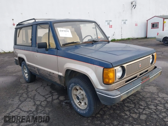 1986 Isuzu Trooper z VIN JACCH55L1G7801560, wystawiony jako IAAI lot #41878592 z przebiegiem 139 020 mil mil oraz . Historia ofert i sprzedaży dostępna na DreamBid. Obrazek 1.
