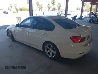 2013 BMW 3 Series 328i with VIN WBA3C1C50DF438180, listed as a IAAI auction lot 42082401 with 206,412 mi miles. Bid and sale history available at carsss.com. Image 3.