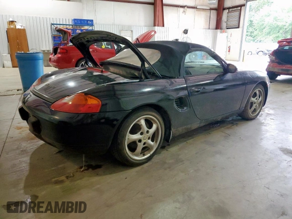 1999 Porsche Boxster z VIN WP0CA2988XU623383, wystawiony jako Copart lot #60567895 z przebiegiem Nie podano mil oraz Czysty tytuł • Clean title. Historia ofert i sprzedaży dostępna na DreamBid. Obrazek 3.