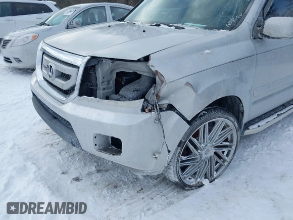 2011 Honda Pilot EX-L with VIN 5FNYF3H6XBB041672, listed as a IAAI auction lot 41337038 with 205,741 mi miles and . Bid and sale history available at DreamBid. Image 6.
