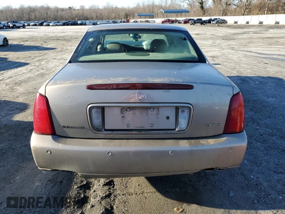 2003 Cadillac DeVille DTS z VIN 1G6KF57963U125853, wystawiony jako Copart lot #42559975 z przebiegiem Nie podano mil oraz Szkody całkowita. Historia ofert i sprzedaży dostępna na DreamBid. Obrazek 6.